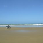 riding a motorcycle on 90 Mile Beach